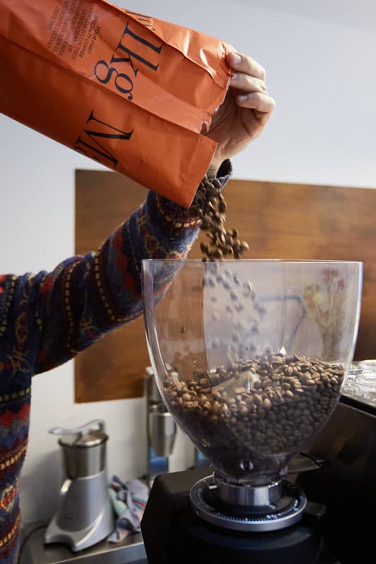 Pouring fresh coffee beans